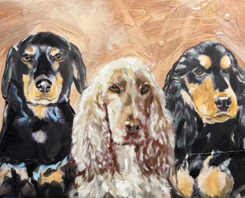 Cocker Spaniel's drie honden op een doek en een Cocker Rottweiler Spaniel